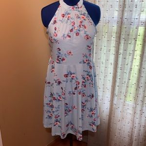 Halter dress in light blue with floral pattern.